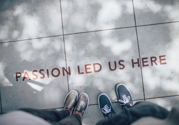 Passion led us here message set in pavement